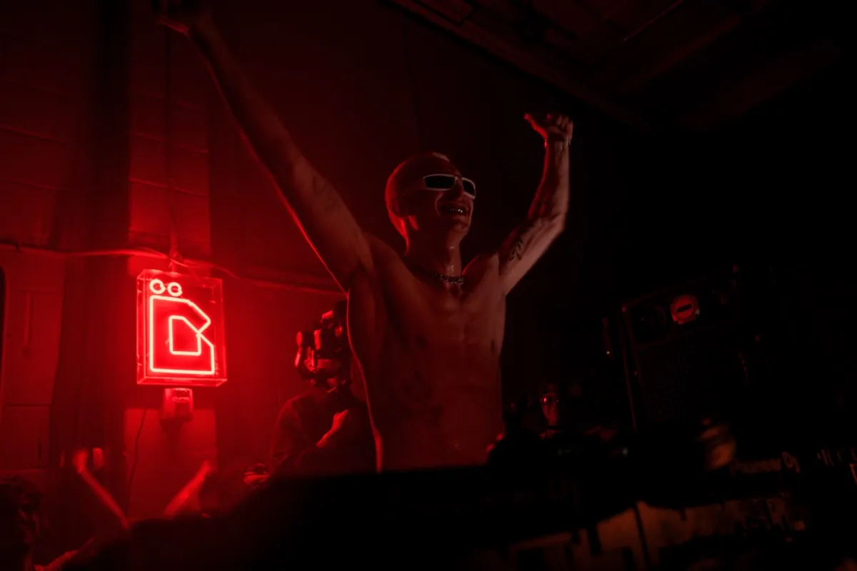 DJ booth at ÄGAPĒ warehouse party in Brooklyn